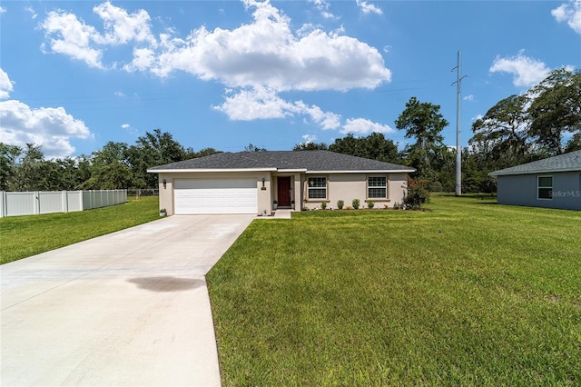 ranch-style house featuring a front yard and a garage