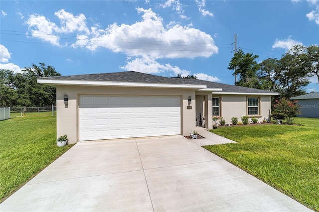 single story home featuring a garage and a front lawn