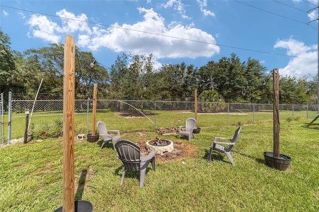 view of yard with a fire pit