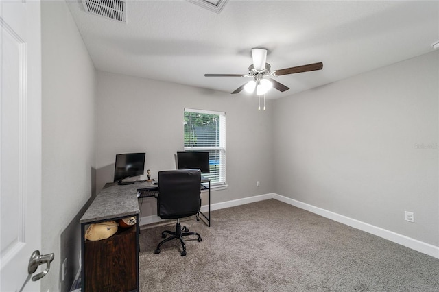 carpeted office featuring ceiling fan