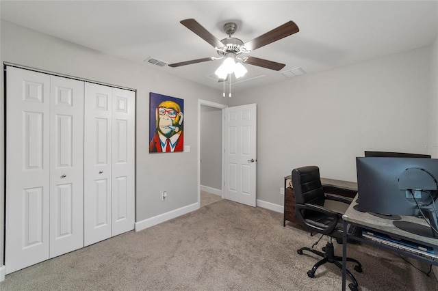 office area with ceiling fan and light carpet