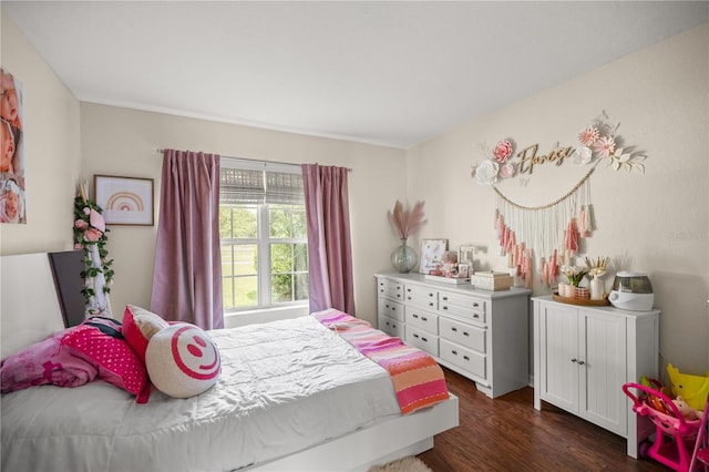 bedroom featuring dark hardwood / wood-style flooring