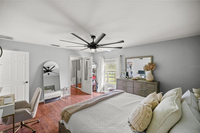 bedroom featuring hardwood / wood-style flooring and ceiling fan