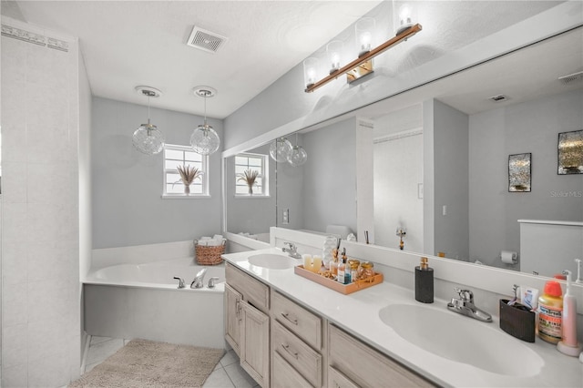 bathroom featuring vanity, a bathtub, tile patterned flooring, and toilet