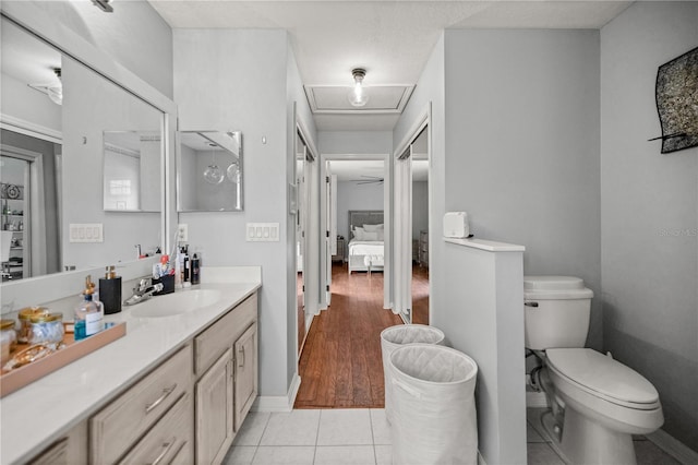 bathroom with vanity, tile patterned floors, and toilet