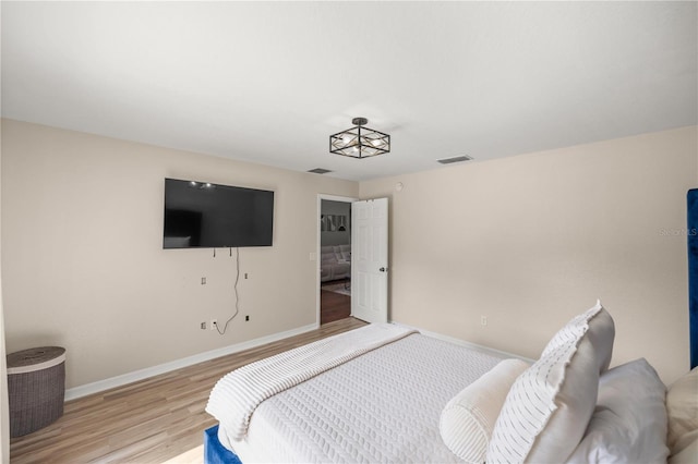 bedroom with light hardwood / wood-style floors