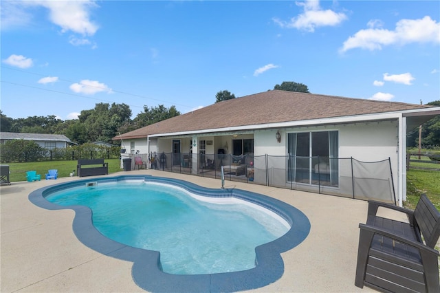 view of swimming pool featuring a yard, central air condition unit, and a patio area