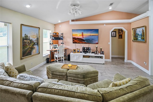 tiled living room featuring lofted ceiling and ceiling fan