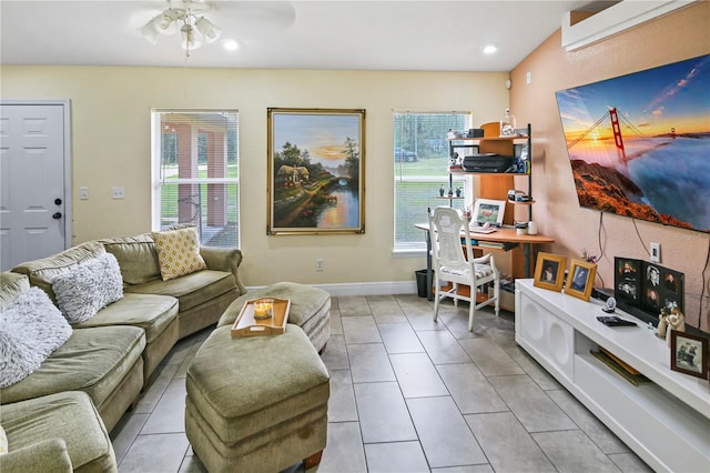 living room featuring ceiling fan and light tile patterned flooring