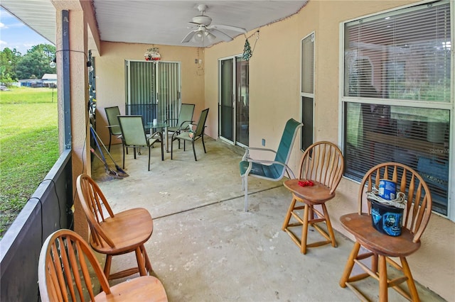 sunroom / solarium with ceiling fan