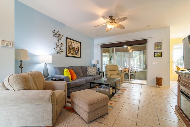 tiled living room featuring ceiling fan