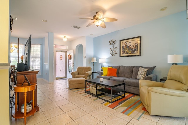 tiled living room featuring ceiling fan