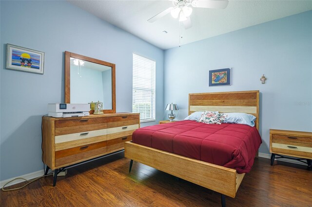 bedroom featuring ceiling fan and dark hardwood / wood-style flooring