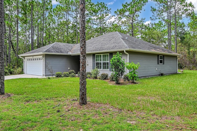 view of home's exterior featuring a garage and a lawn