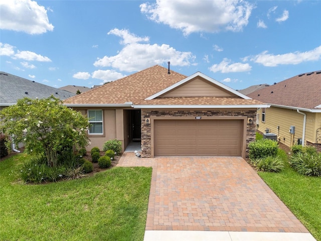 ranch-style home with a garage and a front yard