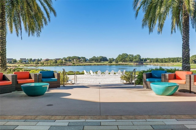 view of patio featuring outdoor lounge area and a water view