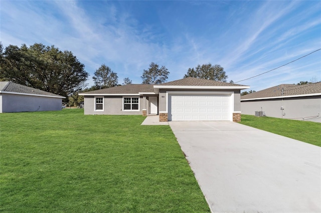 single story home featuring a garage, cooling unit, and a front lawn