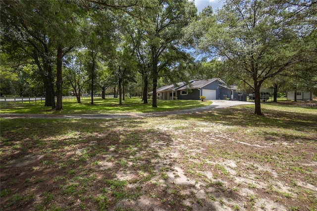 view of yard featuring a garage