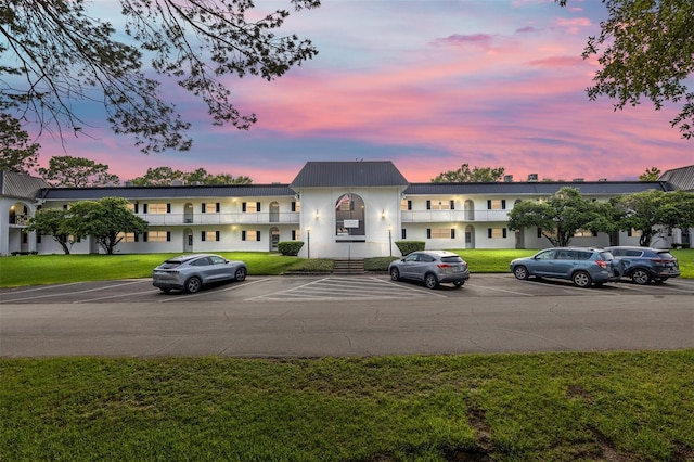 view of outdoor building at dusk