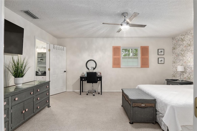 bedroom with light carpet, a textured ceiling, and ceiling fan