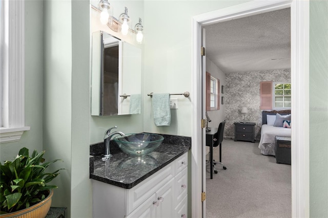 bathroom featuring vanity and a textured ceiling