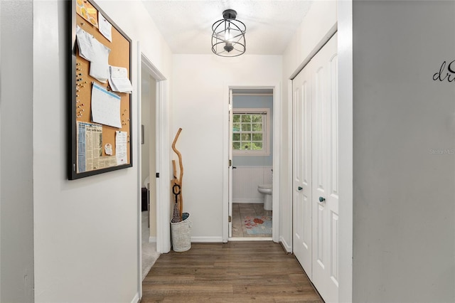 hall with dark hardwood / wood-style flooring