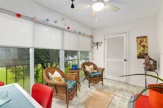 sunroom / solarium featuring a wealth of natural light and ceiling fan