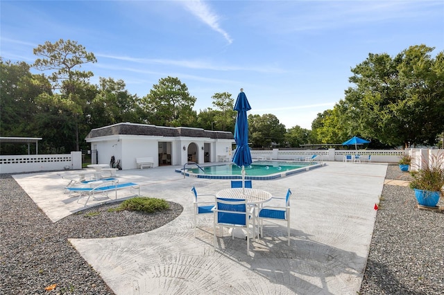 view of swimming pool with a patio area