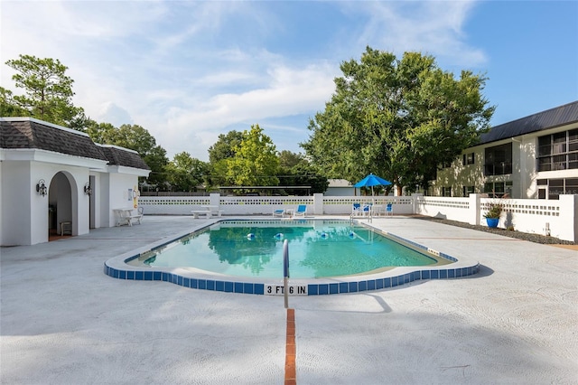 view of swimming pool featuring a patio area