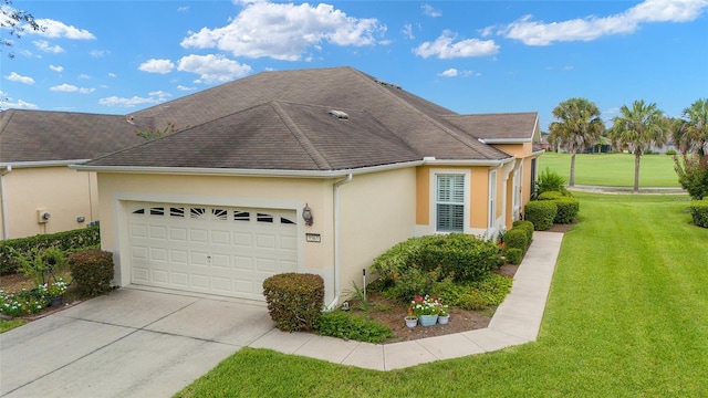 view of property exterior with a garage and a yard