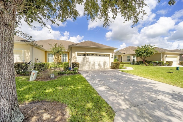 ranch-style home featuring a front lawn and a garage