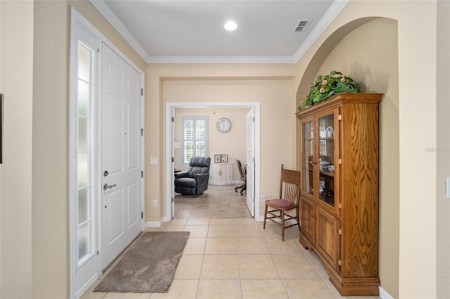 tiled foyer with crown molding