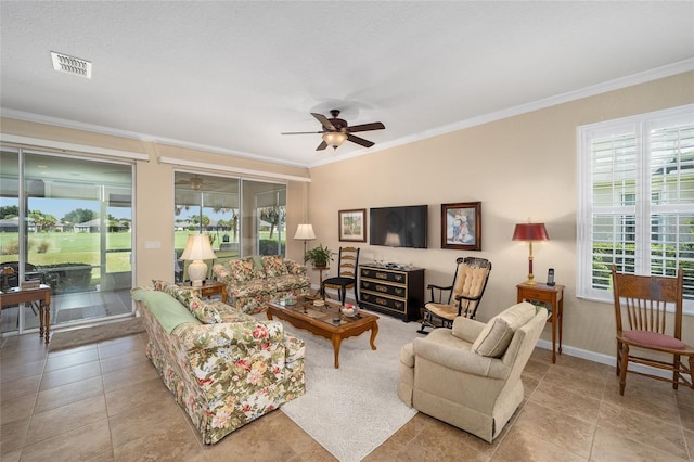 living room featuring light tile patterned flooring, ceiling fan, and ornamental molding