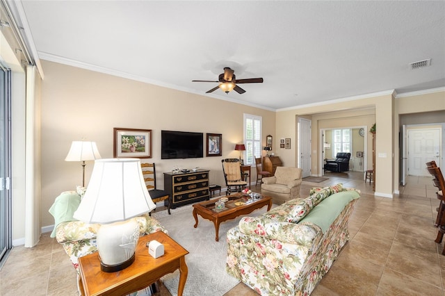 living room featuring ceiling fan and crown molding