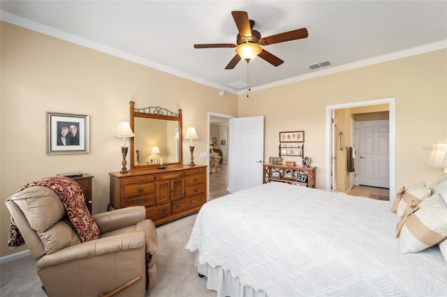 carpeted bedroom featuring ceiling fan and crown molding