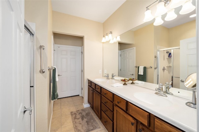 bathroom featuring walk in shower, tile patterned flooring, and vanity