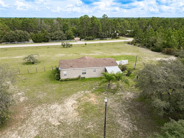 drone / aerial view with a rural view and a wooded view