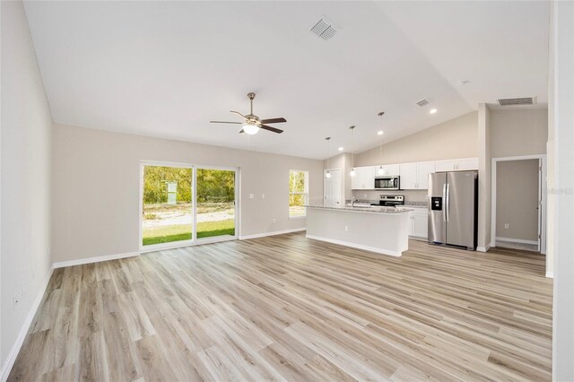 unfurnished living room with high vaulted ceiling, ceiling fan, and light wood-type flooring