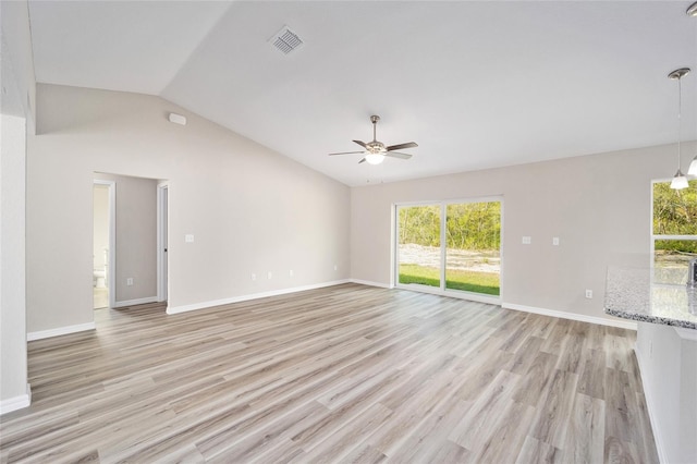 unfurnished living room with lofted ceiling, ceiling fan, and light wood-type flooring