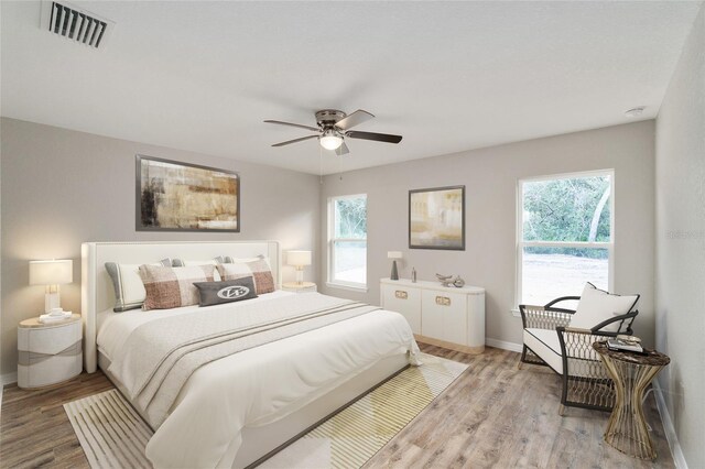 bedroom featuring light hardwood / wood-style flooring and ceiling fan