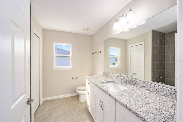 bathroom with tile patterned floors, toilet, and vanity