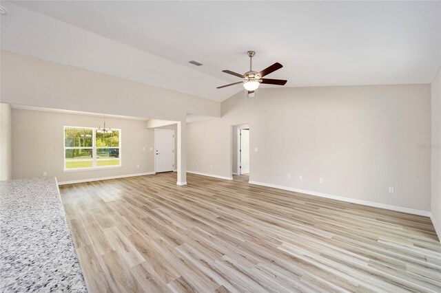 unfurnished living room with high vaulted ceiling, light wood-type flooring, and ceiling fan