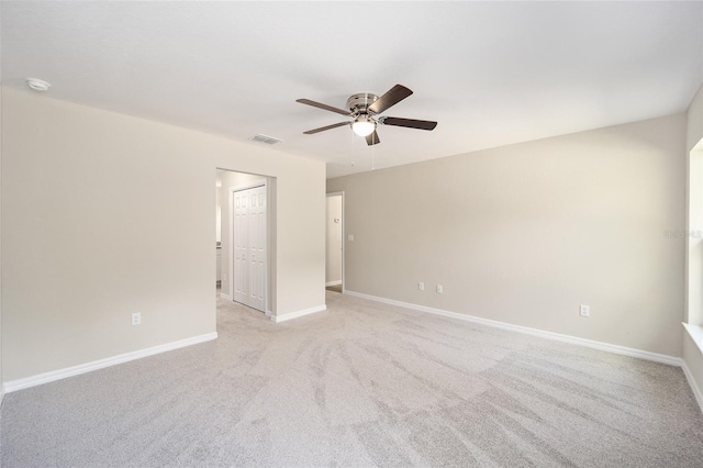 carpeted empty room with ceiling fan