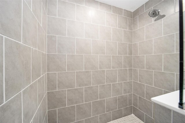 bathroom with tiled shower