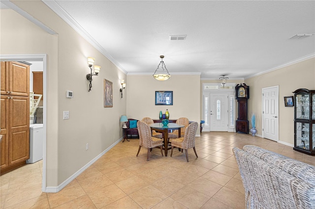 dining area featuring crown molding and light tile patterned floors