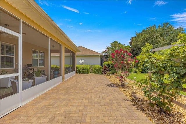 view of patio with a sunroom