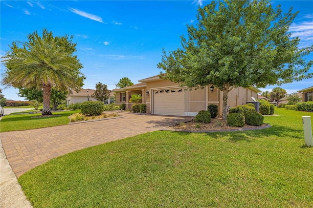 view of front of home featuring a garage and a front yard