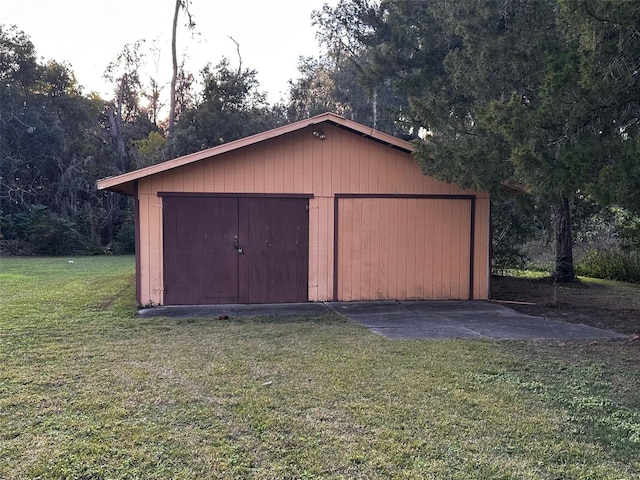 view of outdoor structure featuring a lawn