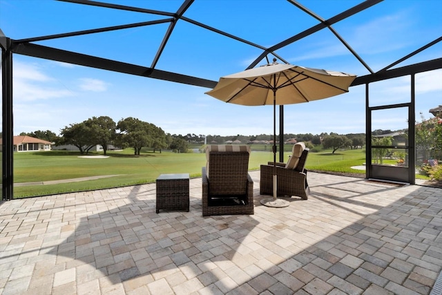 view of patio featuring a lanai