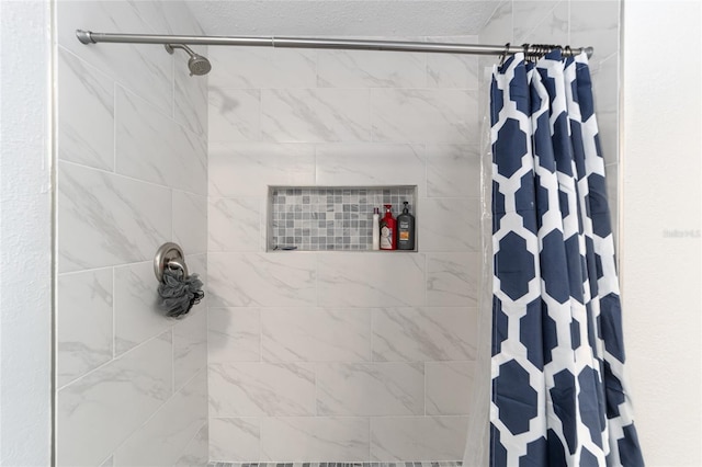 bathroom featuring a shower with curtain